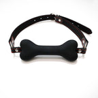 Black bone-shaped silicone mouthpiece with adjustable black PU strap